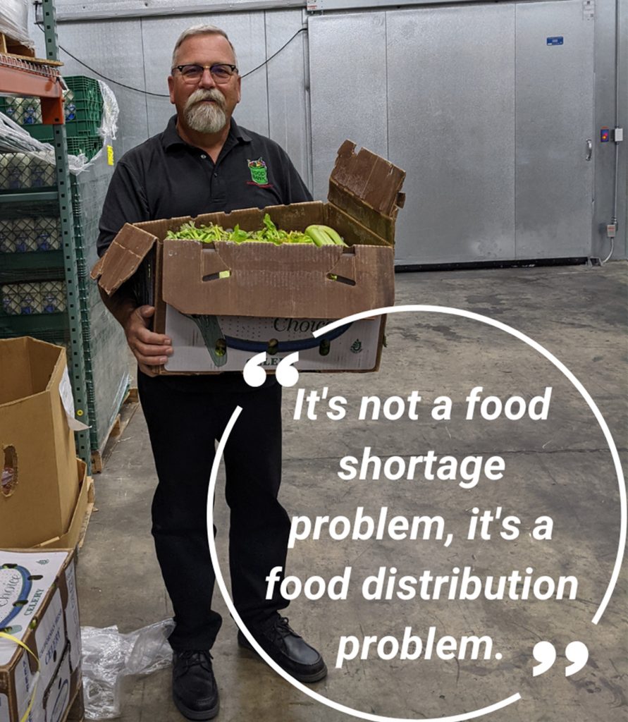 frc-tom-quote Tom Dearmore holding rescued food.